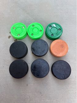 Lot of 9 Hockey Pucks