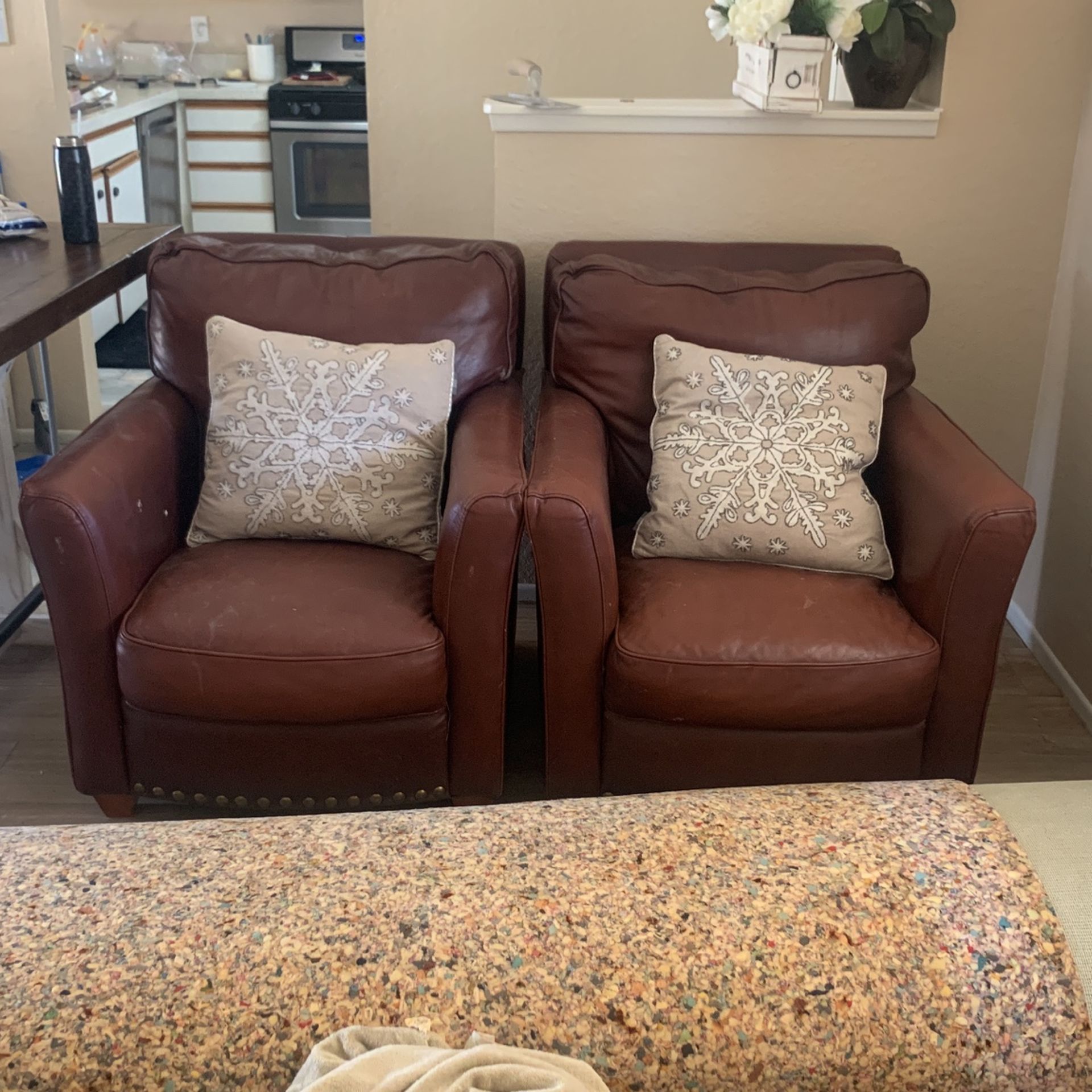 Matching cowhide accent chairs