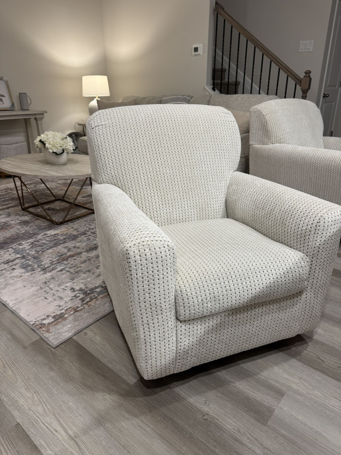 IVORY SWIVEL GLIDER ACCENT CHAIR