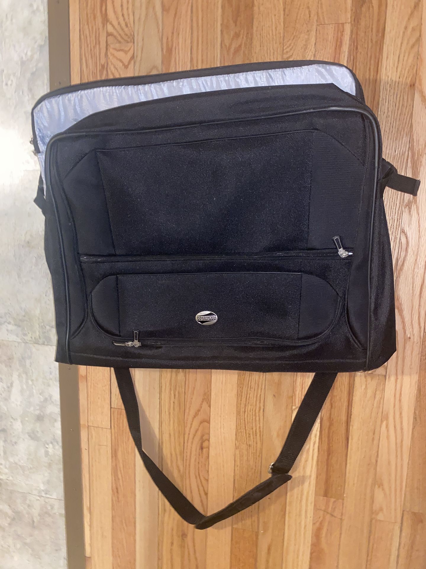 black American Tourister garment bag