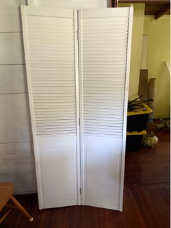 Bi fold white wooden doors