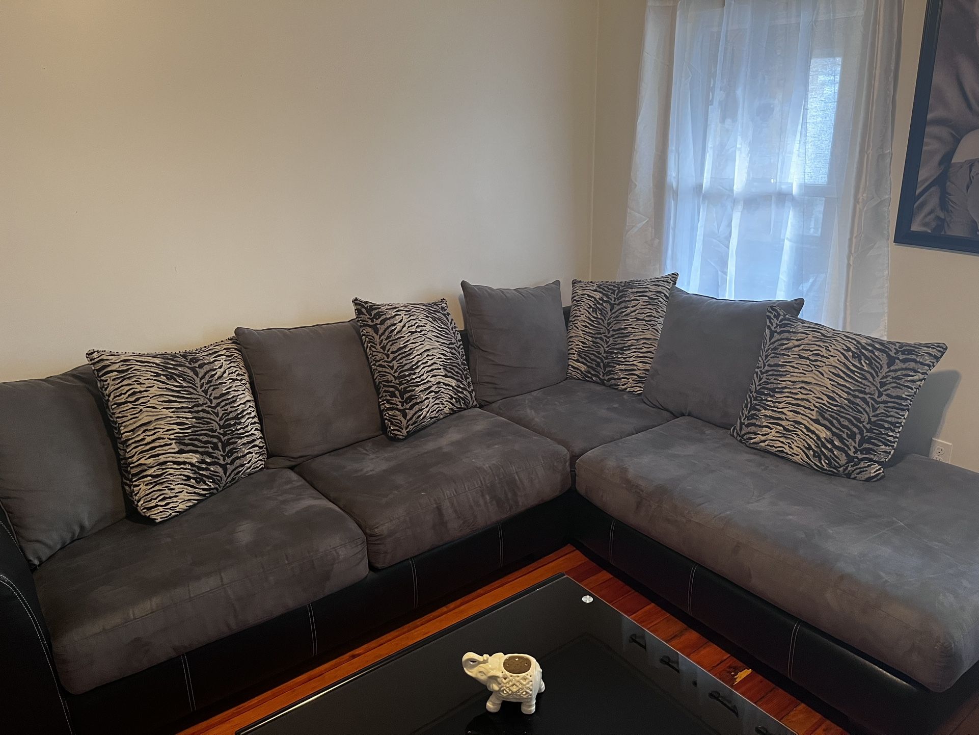 Ashley Sectional 2 Piece Suede Grey Sofas With 3 Black Glass Tables And 2 Lamps an Electric Fire Place Dark Brown