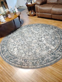 Like new 6 feet round rug color brown
