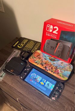 NINTENDO SWITCH 2 + ACCESSORIES (BOX, NEW JOYCONS, CARRYING CASE/BODY CASE, SCREEN PROTECTORS) $450
