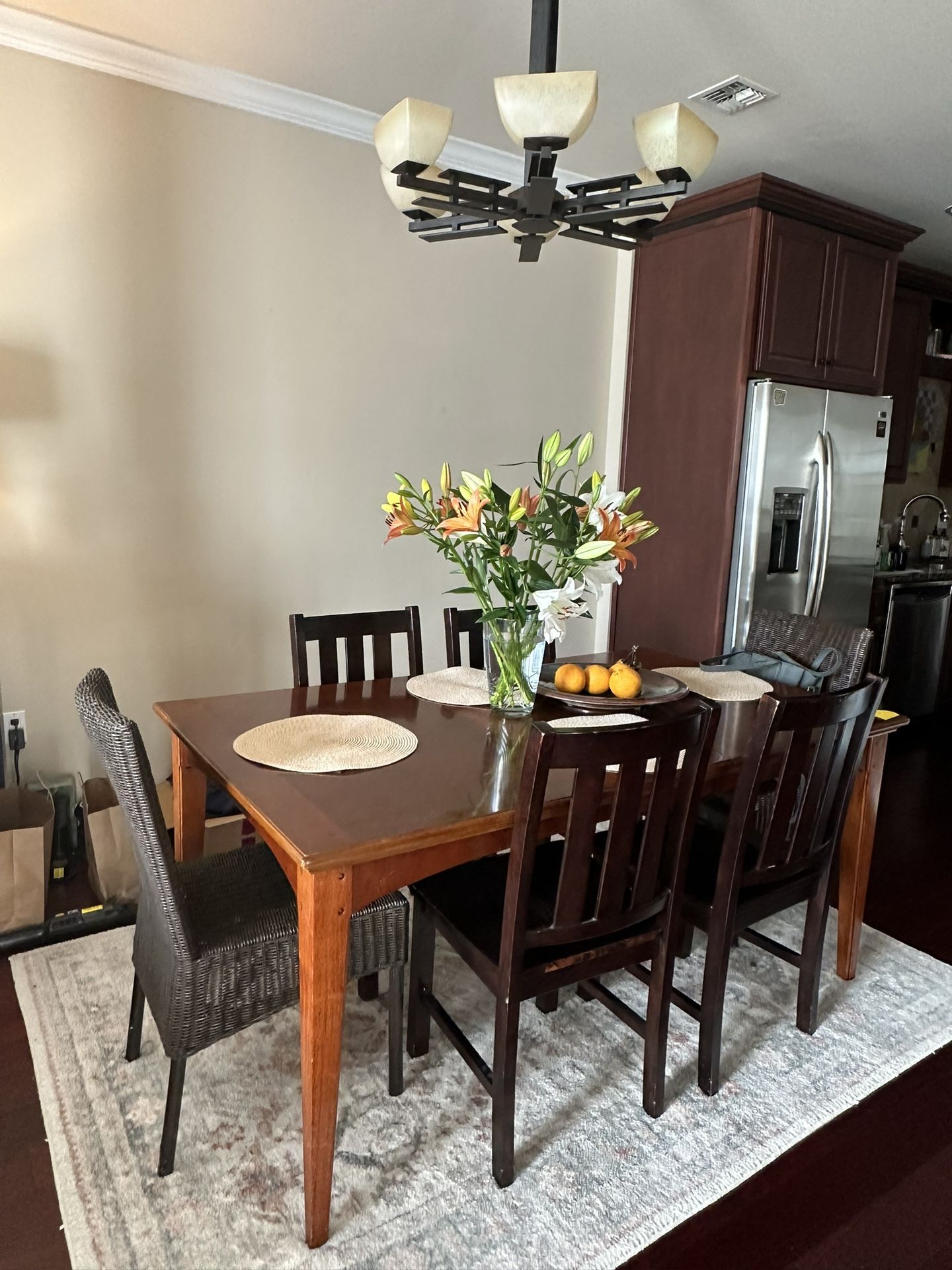 Beautiful Dining Table with 4 Chairs And 2 Captain Wicker Chairs