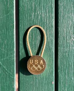 Vintage 1980s USA Olympics keychain, gold metal