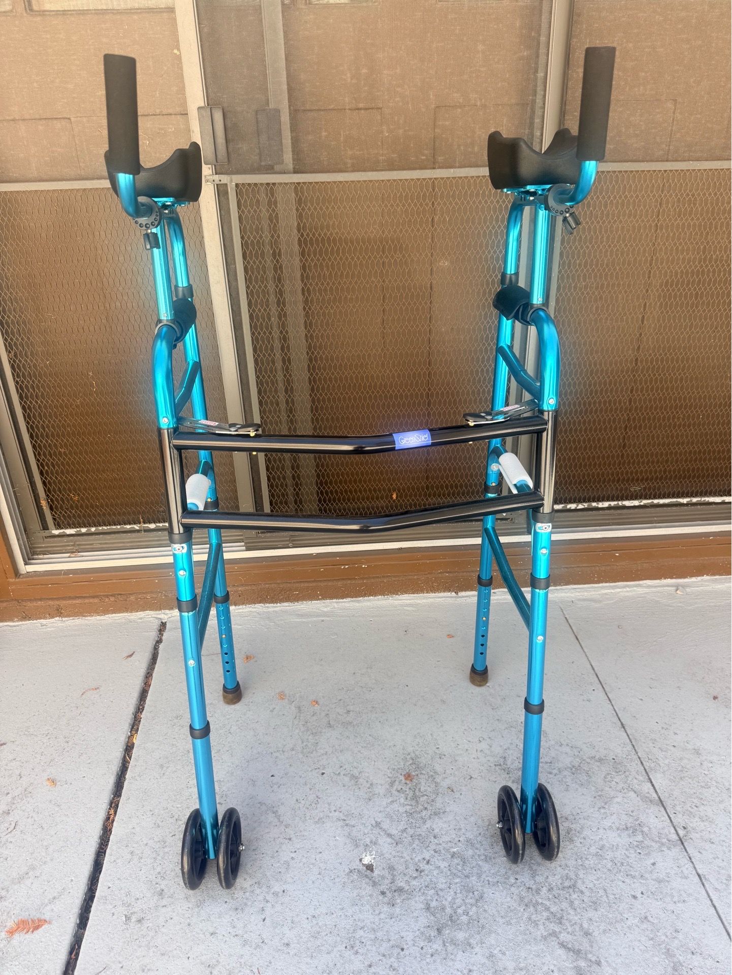 Blue Costway Folding Aluminum Alloy Walker with armrest support.