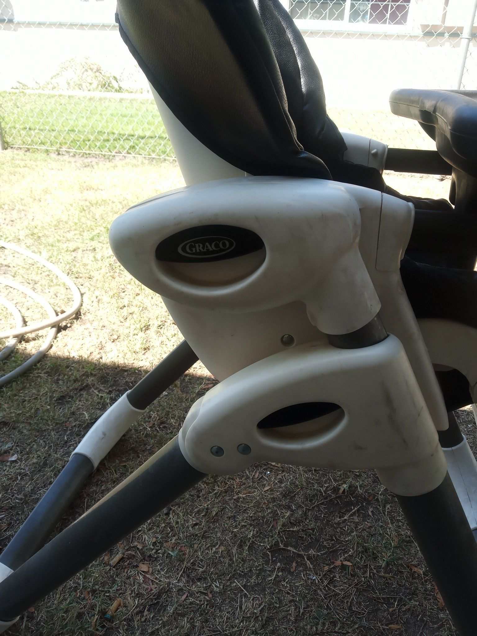 Graco portable black leather high chair