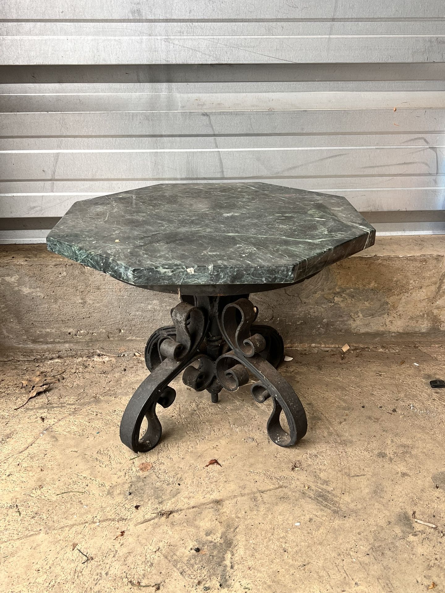 Victorian cast iron bistro table with a marble top.