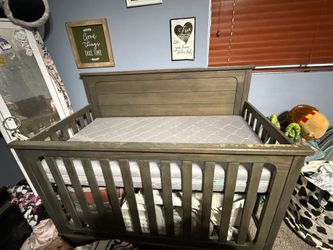 Rustic crib and newton mattress