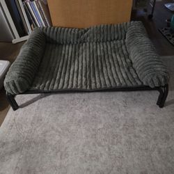 Raised dog bed.