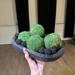 black wooden bowl with decor