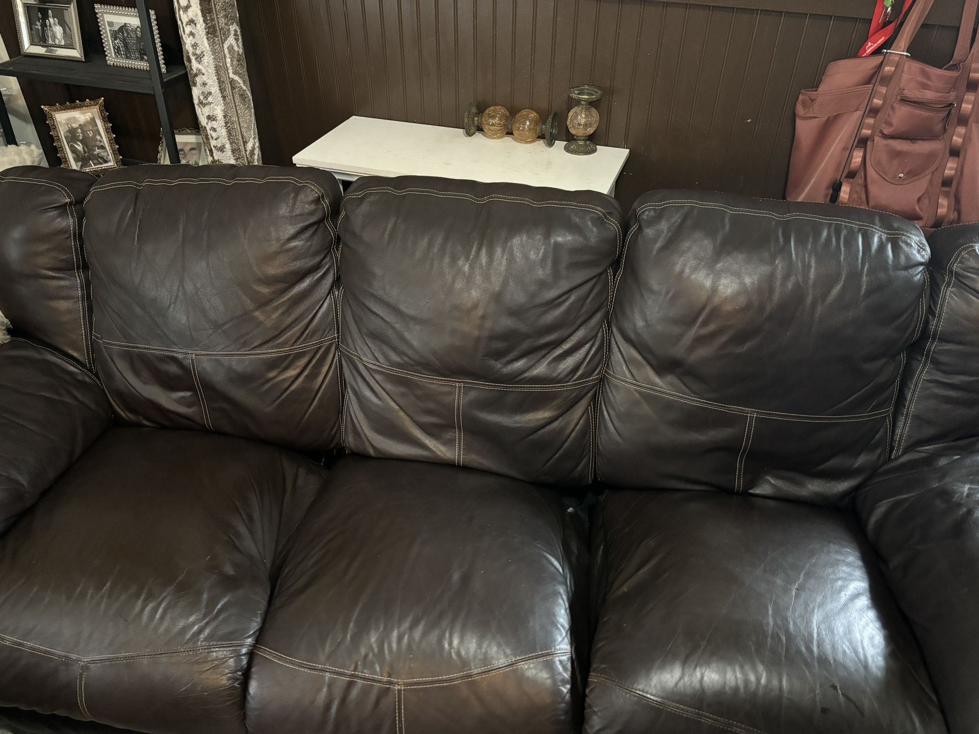 Brown leather reclining sofa couch