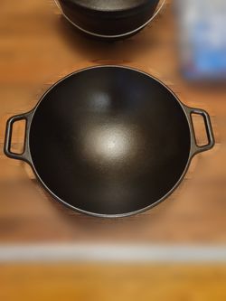 Lodge 14 inch pre-seasoned cast iron wok with loop handles