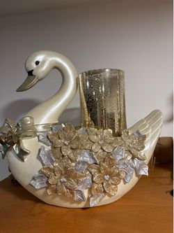 Two beautiful white and gold swans figurine set. Glittery floral decoration and  gold candle light holder.