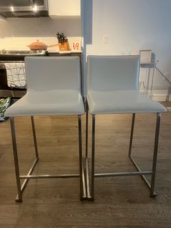 Two bar stools in excellent condition