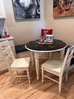 Table 37” and two chairs