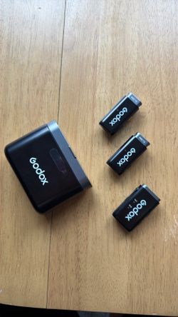 Godox Wireless Microphone Kit w/ Charging Case + Carrying Case – $60