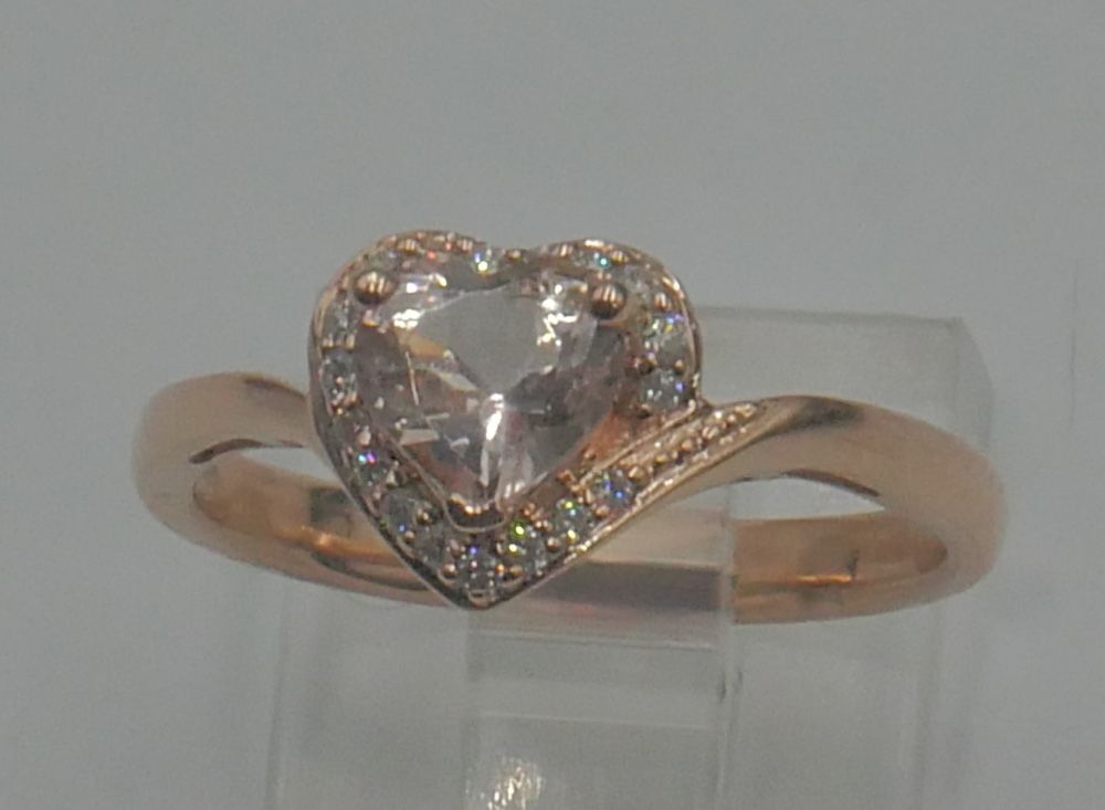 10kt rose gold ring 2.5 gr w 18 small diamonds & pink heart shaped CZ size 7.25. 878899-1. very good condition. 
