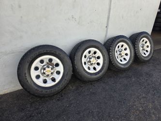 17" CHEVY OEM rims w/ used tires. $125