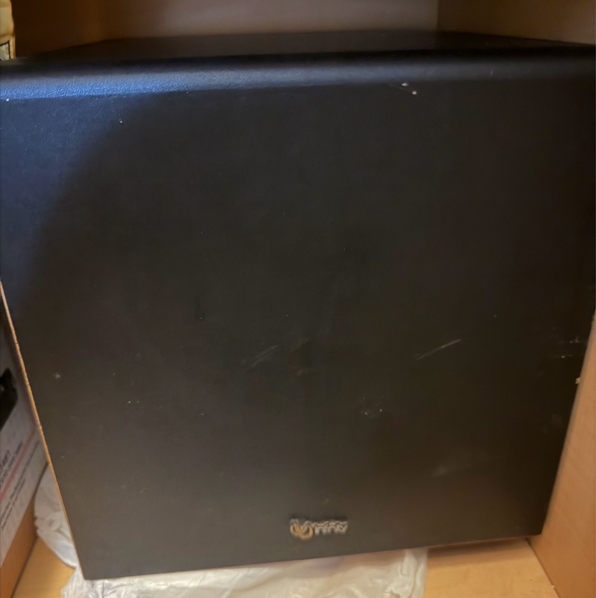 Infinity BU-1 Powered Subwoofer with an 8" driver, often found in home theater setups