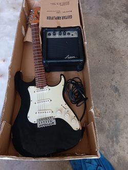 Guitarras Eléctrica Poco Uso con su equipo de sonido usada nina no sabia tocar equipo De amplificar casi no se uso le falta dos cuerda de 250 a 125 pa
