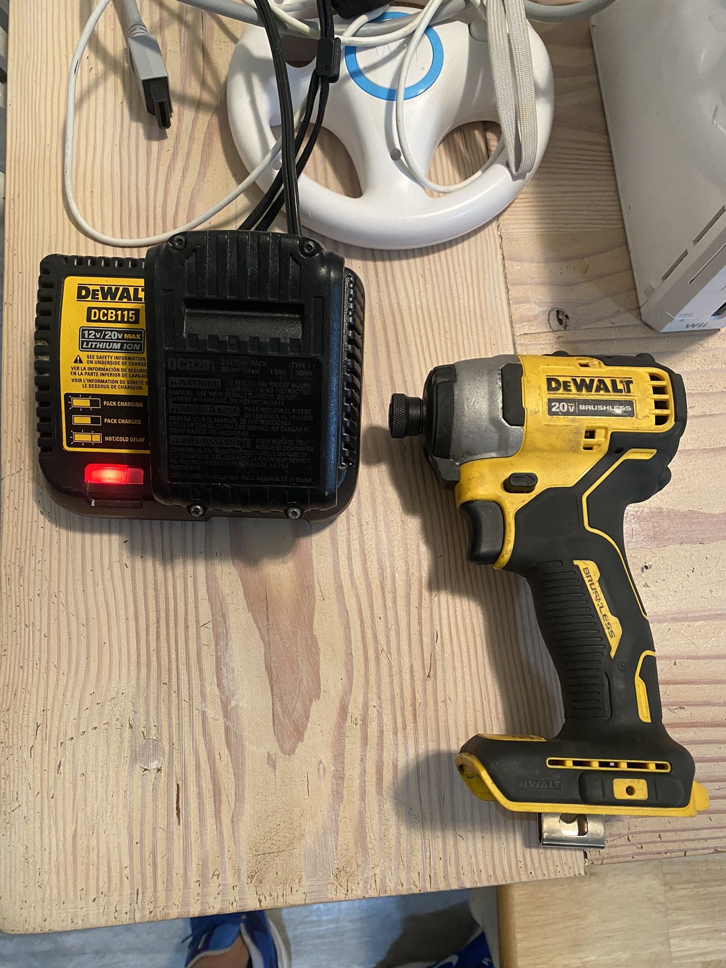 ATOMIC 20V MAX  Cordless Brushless Compact 1/4 in. Impact Driver (Tool and charger only) Dewalt drill used my batter to test it my battery is not incl