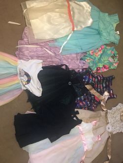 35 each pile boys clothes , girl dresses