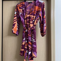 Brand new adorable women’s size small romper. Colorful print. Tie belt . Tags still on 