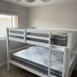 Full over Full bunk bed. Dark walnut,grey & white-$499. Full mattresses -$125.00 each. Assembly not included. Taxes included. Free delivery.  Se habla