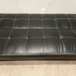 Sofa/Futon converts to a bed Excellent condition 