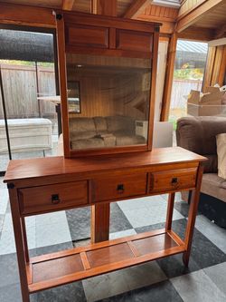 wooden console table with a matching mirror attachment