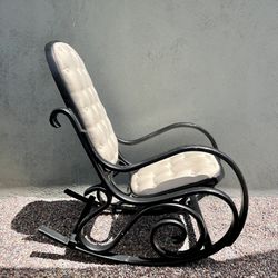 Mid-century Thonet style sculptural rocking chair with light cream tufted fabric. 