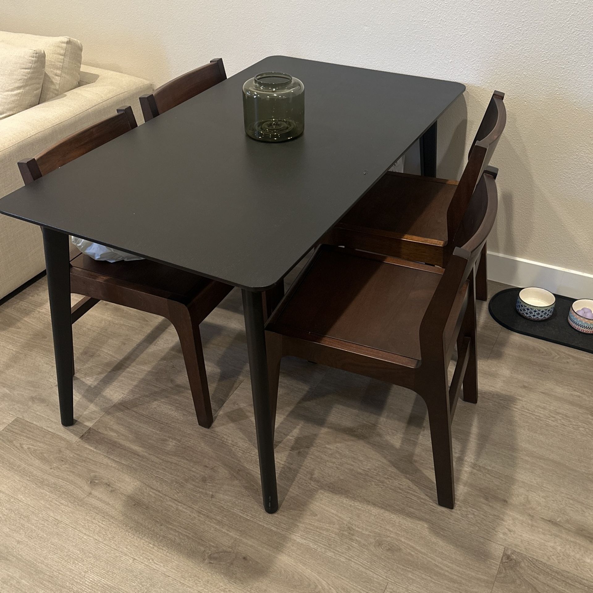 Black Dining Table With Four Wooden Chairs