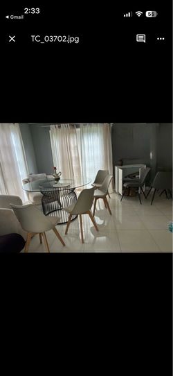 Round glass dinning table four chairs