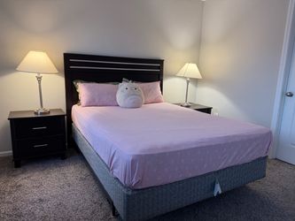 Dark Espresso Queen Bed Frame with Headboard and a super comfortable mattress with four pillows