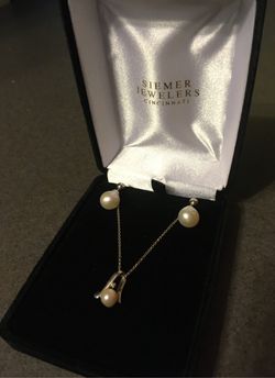 Pearl drop earrings and pearl necklace with diamond accent purchased from Siemer Jewelers