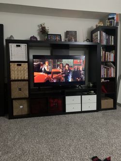 Entertainment Center Holds 65” TV