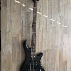 A used Schecter Guitar Research DIAMOND SERIES STILETTO DELUXE 4 Black Electric Bass Guitar 