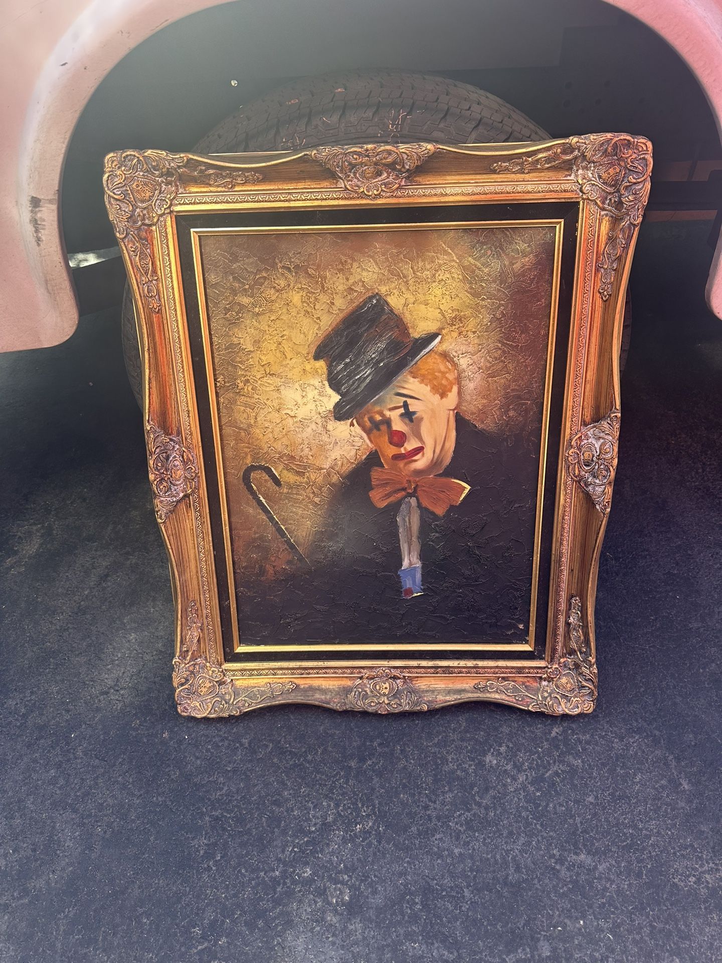 oil painting of a clown with a wooden gilded frame