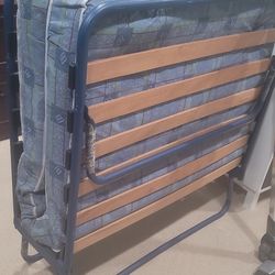 Folding bed with mattress