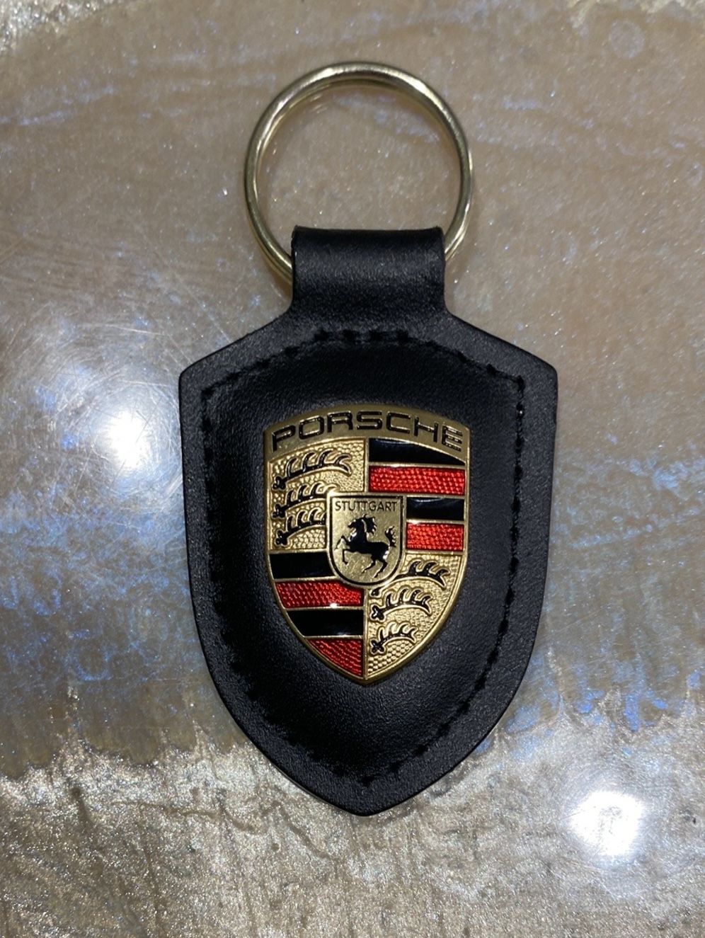 Porsche Keychain with Black and Gold Elegant design Features iconic logo