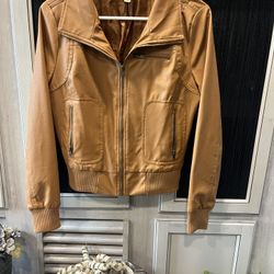 Imitation leather jacket and good condition zippers all work clean