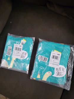 2 sets of matching dinosaur pajamas