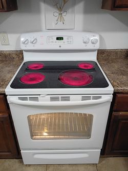 GE, White Electric Stove.