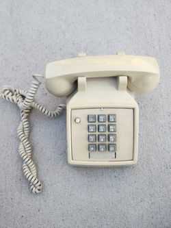 vintage landline phone
beige push-button telephone
8x9x5H"
$10