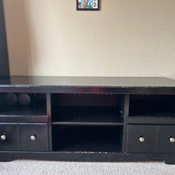 TV Stand / Media Console – Good Condition Selling a black TV stand/media console. 