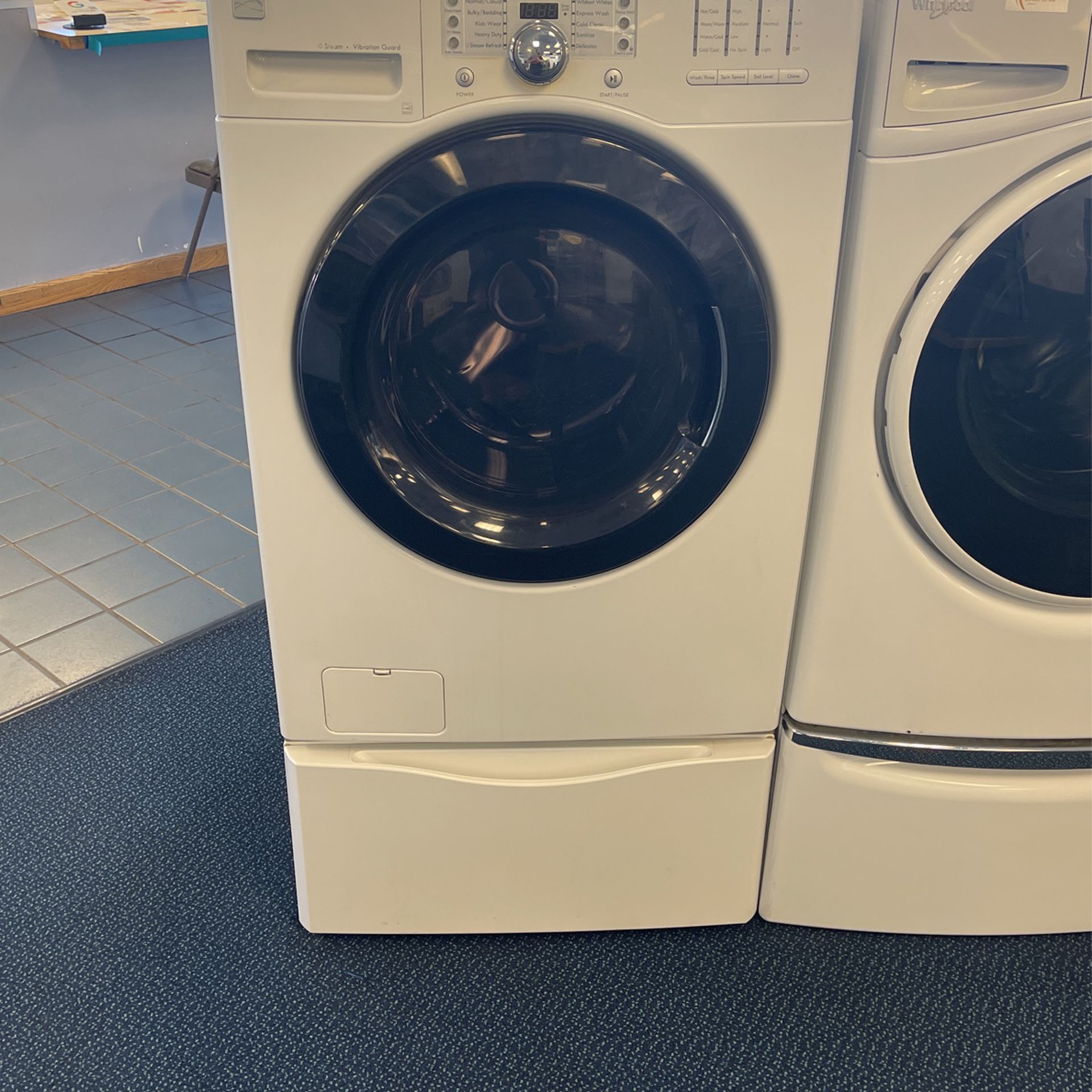 White Kenmore Front Load Washer on Pedestal