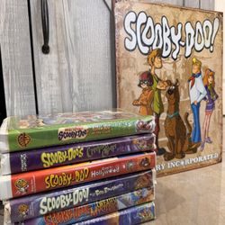 Scooby-doo vhs collection with metal sign