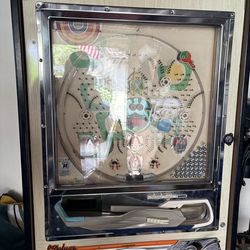 Japanese stand up pinball machine.